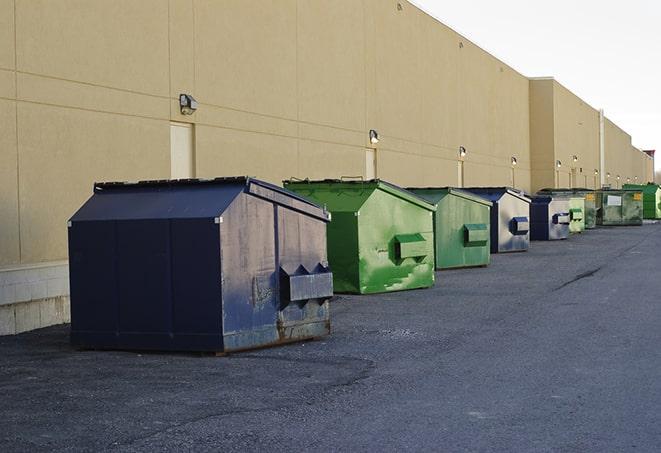 a series of colorful, utilitarian dumpsters deployed in a construction site in Aliso Viejo CA